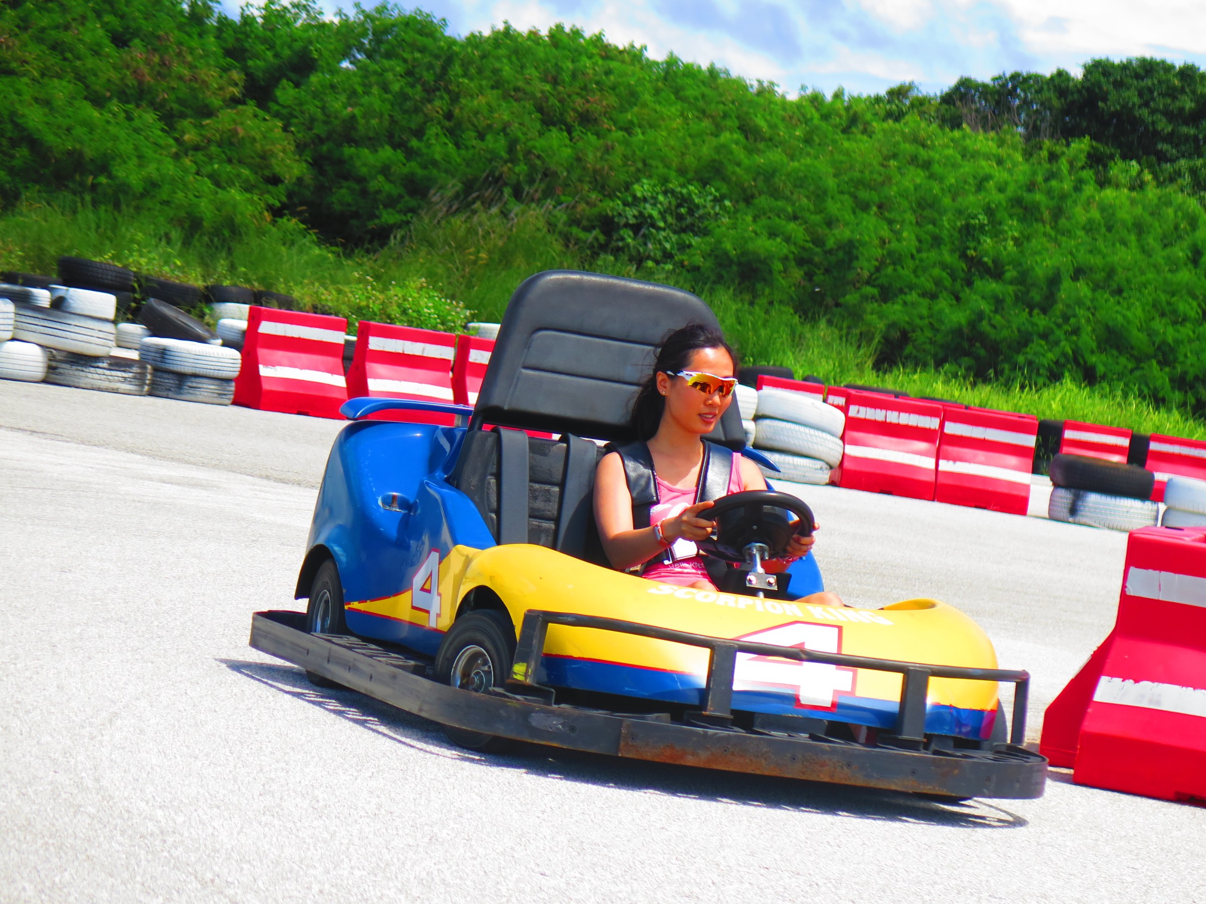 A woman having a fun time driving her go-kart